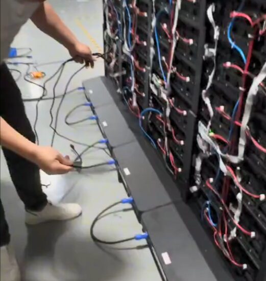 connecting input and output signal cables to a large LED video wall with complex wiring