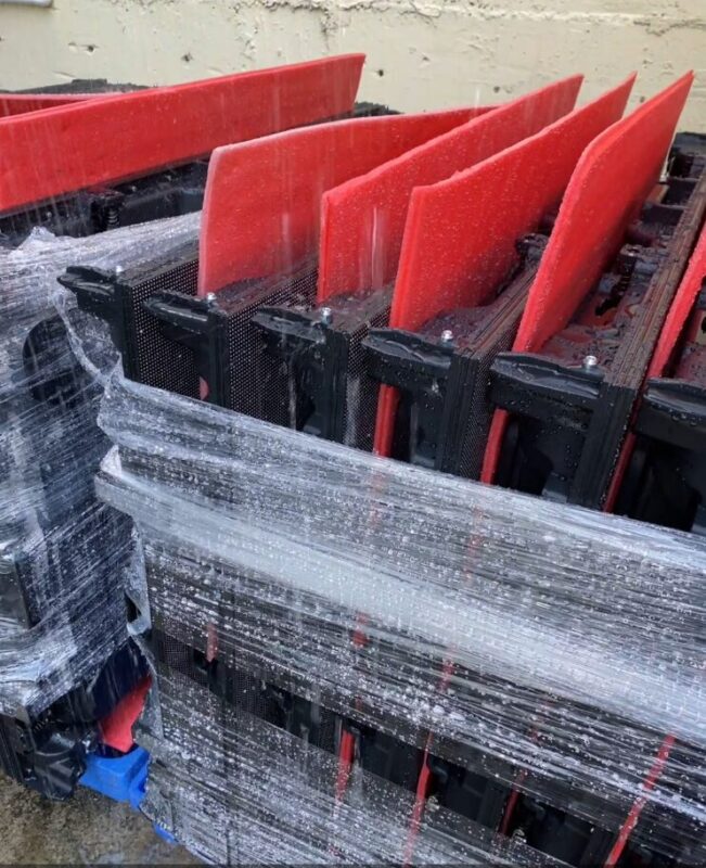 Front view of outdoor LED display cabinet under watering conditions